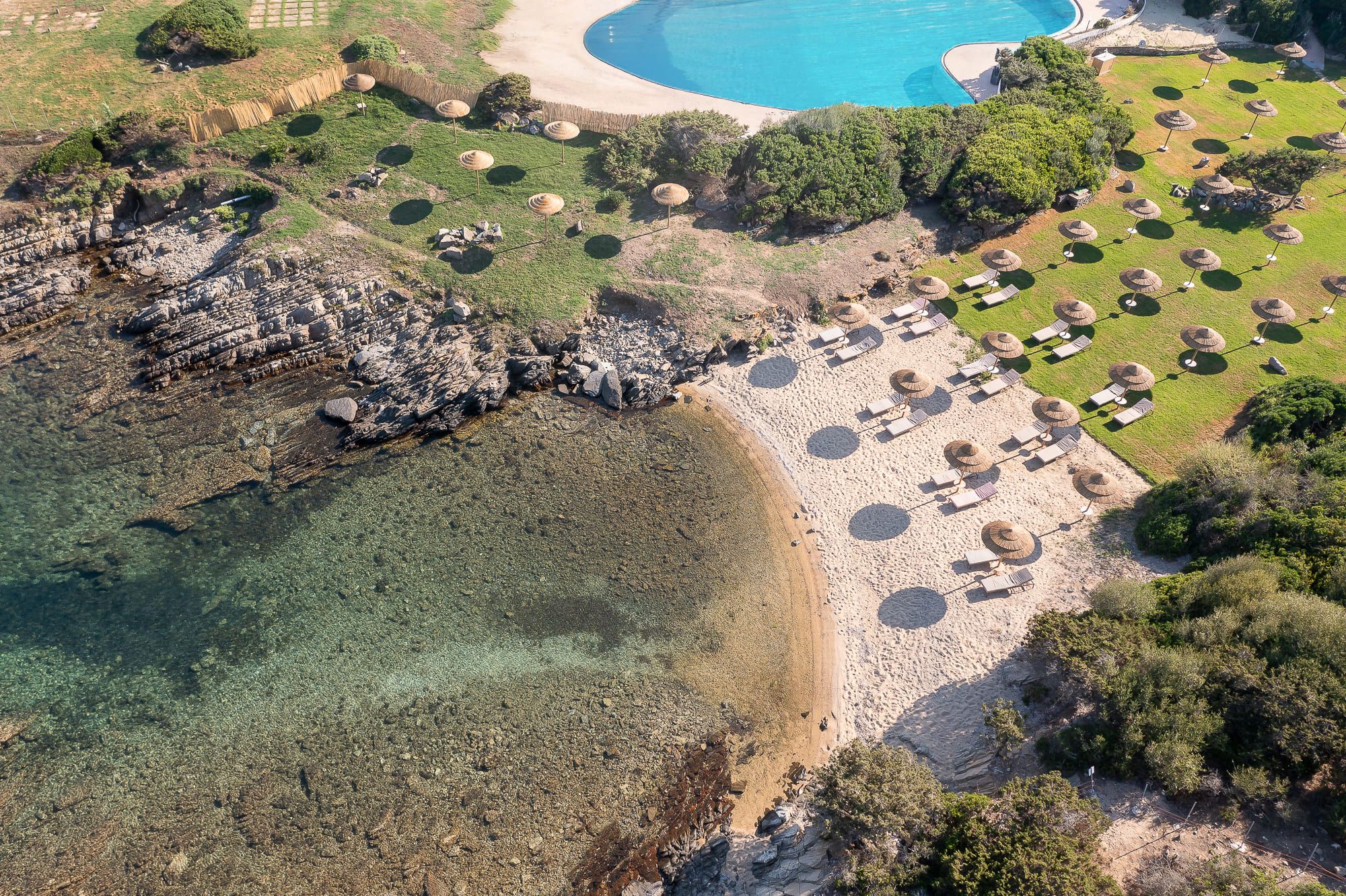 Saltwater pool club with sea view at Cala Lupo Resort Stintino